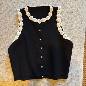 Elegant Black Sleeveless Top with Cream Floral Trim